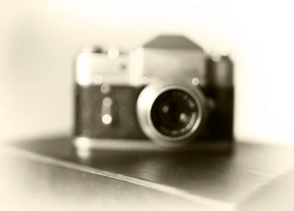 Vintage camera bokeh blur background — Stock Photo, Image