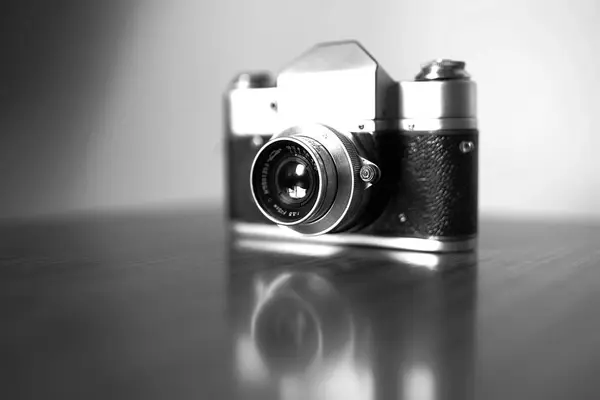 Black and white vintage camera vignette bokeh background — Stock Photo, Image