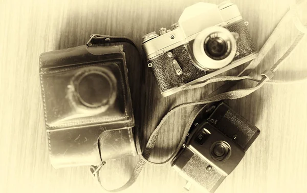 Horizontální ročník tři kamery bokeh pozadí — Stock fotografie