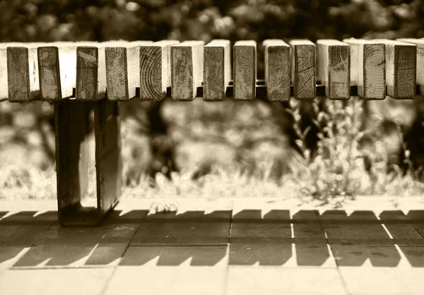 Horizontal Sepia Parkbank Bokeh Hintergrund — Stockfoto