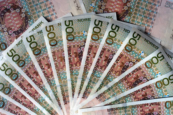 500 Norwegian krones face on wood desk background