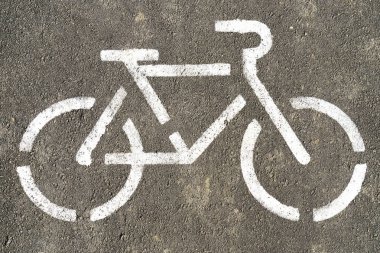 Bisiklet sembolü dokulu asfalt zemin üzerine