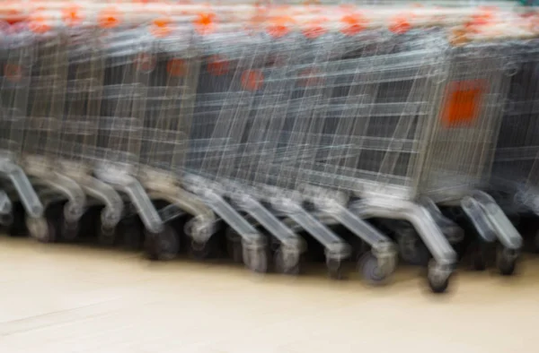 Horizontal supermarket cart bokeh background — Stock Photo, Image