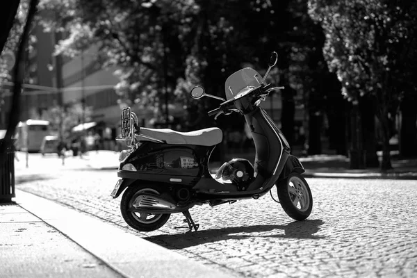 Black and white moped bike on Trondheim streets background