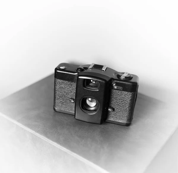Black and white vintage camera vignette bokeh background — Stock Photo, Image