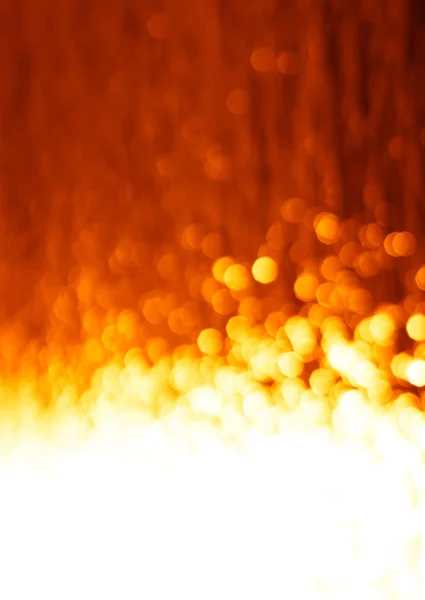 Κάθετη φωτιά με φόντο πορτοκαλί bokeh — Φωτογραφία Αρχείου