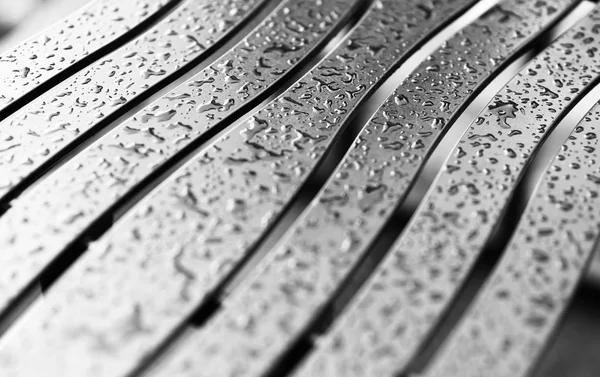 Wavy metal bech with raindrops background