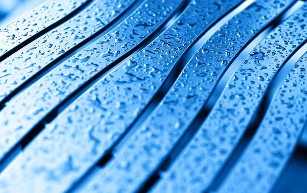 Banco Diagonal azul con fondo de gotas de lluvia — Foto de Stock