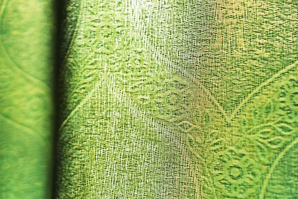 Horizontal vivid green fabric bokeh background — Stock Photo, Image