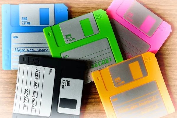 Vintage set of floppy discs on wooden desk background — Stock Photo, Image