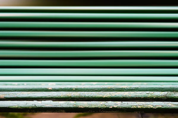 Horizontale dramatische park bench bokeh achtergrond — Stockfoto