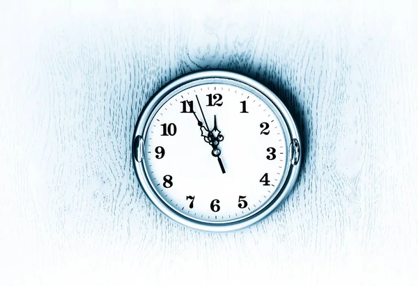 Vintage blue clock on the wall texture background