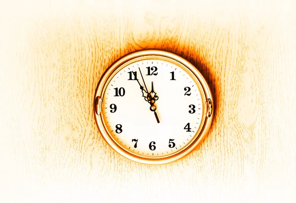 Vintage golden clock on the wall texture background
