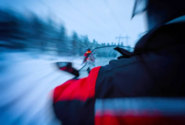 Horizontal vivid snowmobile rider blurred background — Stock Photo, Image