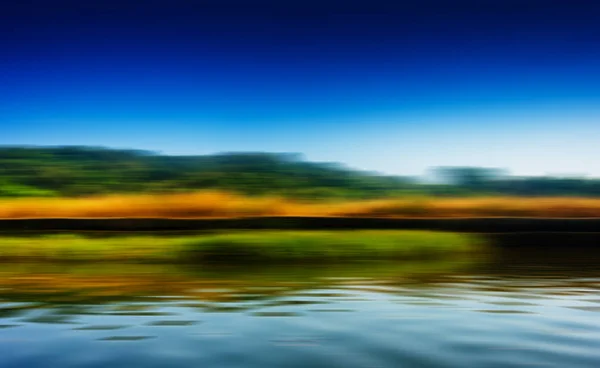 Horizontal riding speed boat on river abstraction — Stock Photo, Image