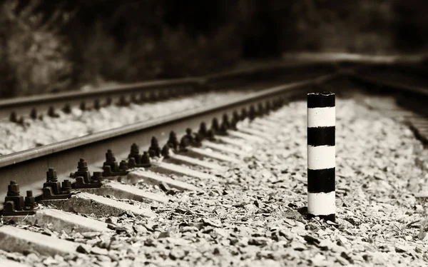 Horizontal sepia railroad milage column bokeh — Stock Photo, Image