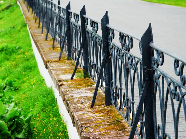 Vintage iron cast fence bokeh background Stock Image