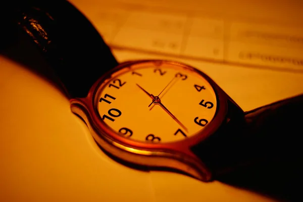 Vintage analog watch on the table bokeh background — Stock Photo, Image