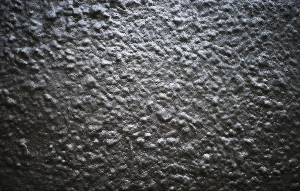 Schwarz und weiß lackierte holprige Betonmauer Hintergrund — Stockfoto