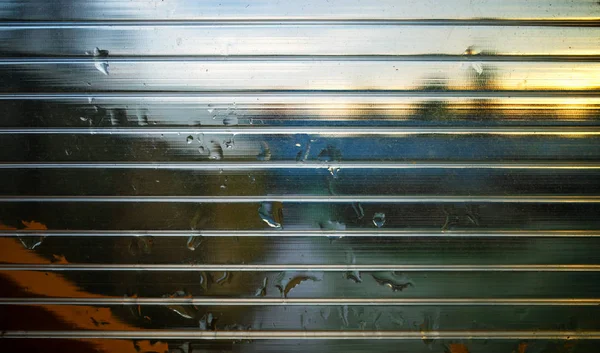 Raindrops on scanline plastic window background — Stock Photo, Image