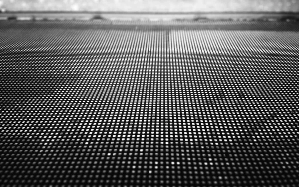 Perforated metal grid texture backdrop — Stok fotoğraf