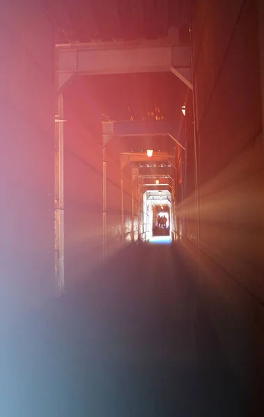 God rays in industrial tunnel background