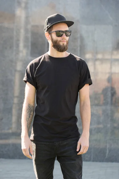 Hipster handsome male model with beard  wearing black blank  t-s — Stock Photo, Image