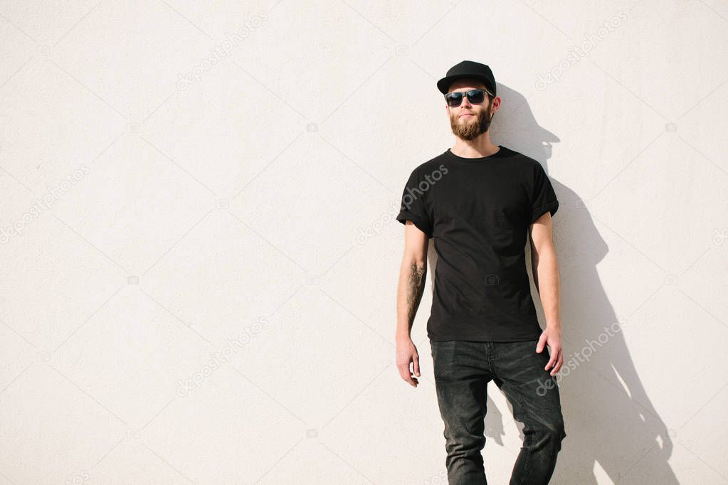 Hipster handsome male model with beard  wearing black blank  t-s