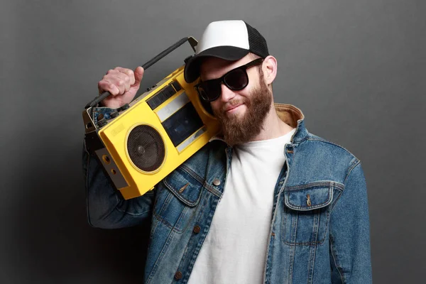 Hipster man listening to cassette player and singing along — Stock Photo, Image