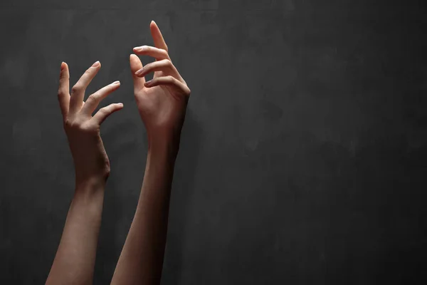 Hand reaching for the sky or for God over dark — Stock Photo, Image