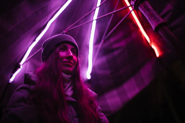 Woman portrait at night in neon light — Stok fotoğraf