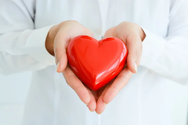 Female hands holding heart mockup — Stock Photo, Image