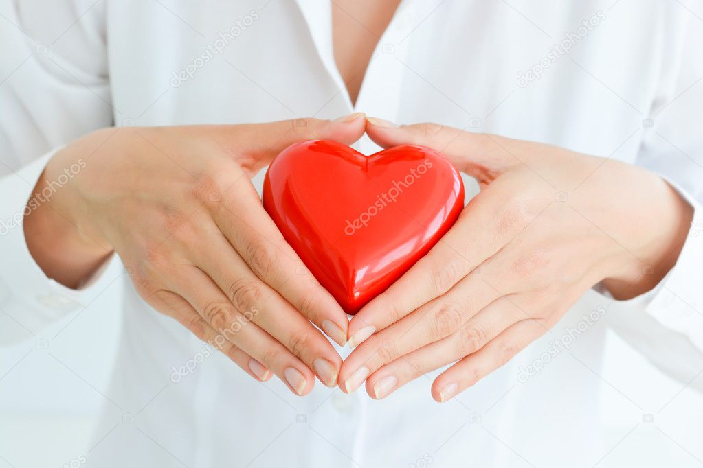 female hands holding heart mockup