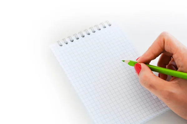 Vrouw hand schrijven op lege wiskunde boek — Stockfoto