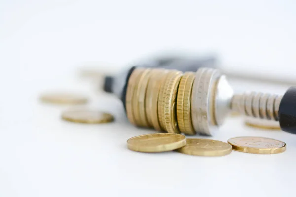 Economy pressure concept with stack of coins in a cramp — Stock Photo, Image