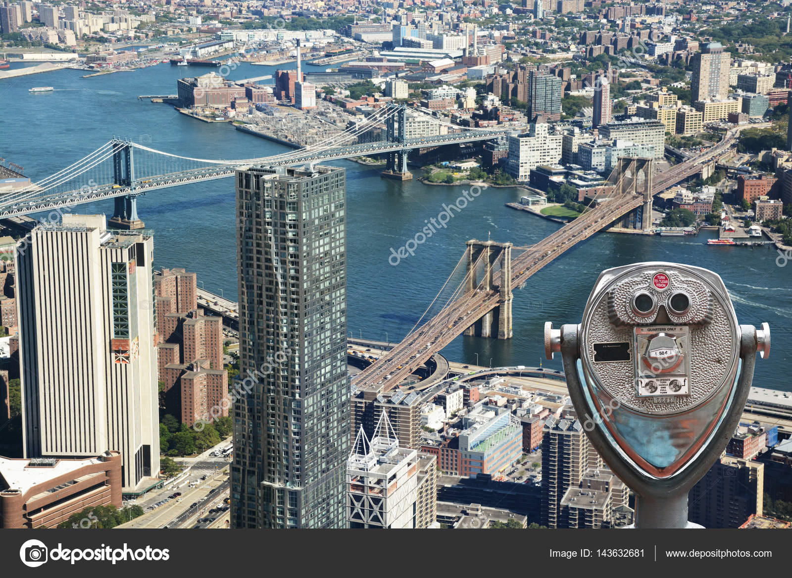 Sightseeing telescope against Brooklyn Bridge and Manhattan Bridge, New