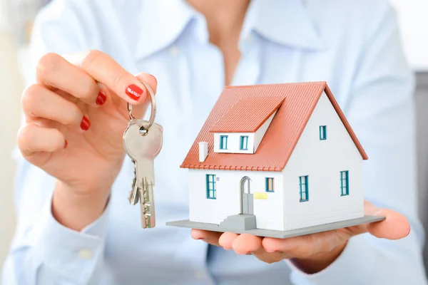 Real estate agent hand over property or new home keys to a customer Royalty Free Stock Photos