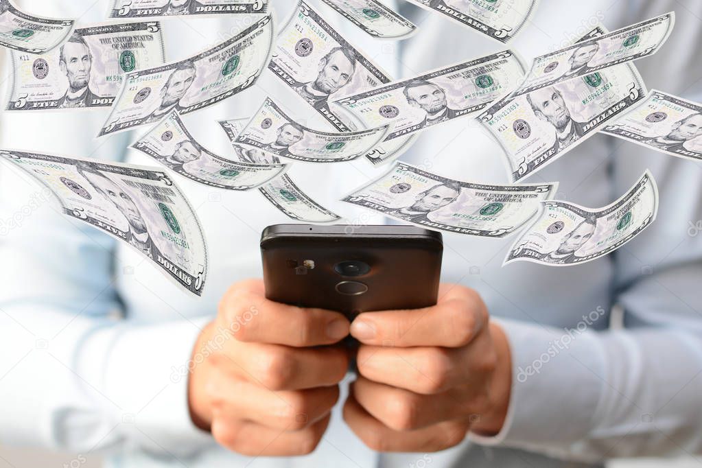 Making money online concept with woman hand holding a smartphone