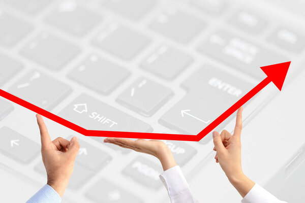 The perks of teamwork suggested by a growth arrow going up, held by three business peoples hands on technology motif background