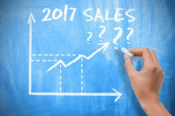 Sales forecast for 2017 with graph chart on blue chalkboard — Stock Photo, Image