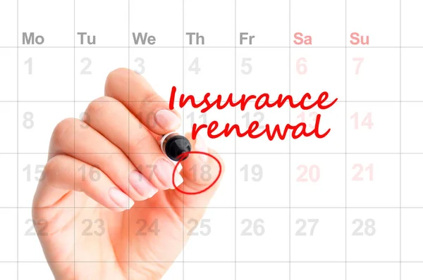 Insurance renewal reminder in calendar handwritten by woman hand — Stock Photo, Image