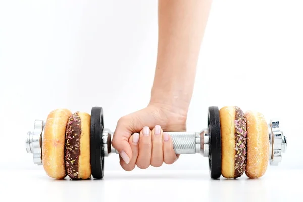 Концепція здорового способу життя, запропонована вагомими пончиками — стокове фото
