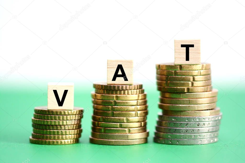 VAT or Value added tax on stack of coins suggesting tax increase