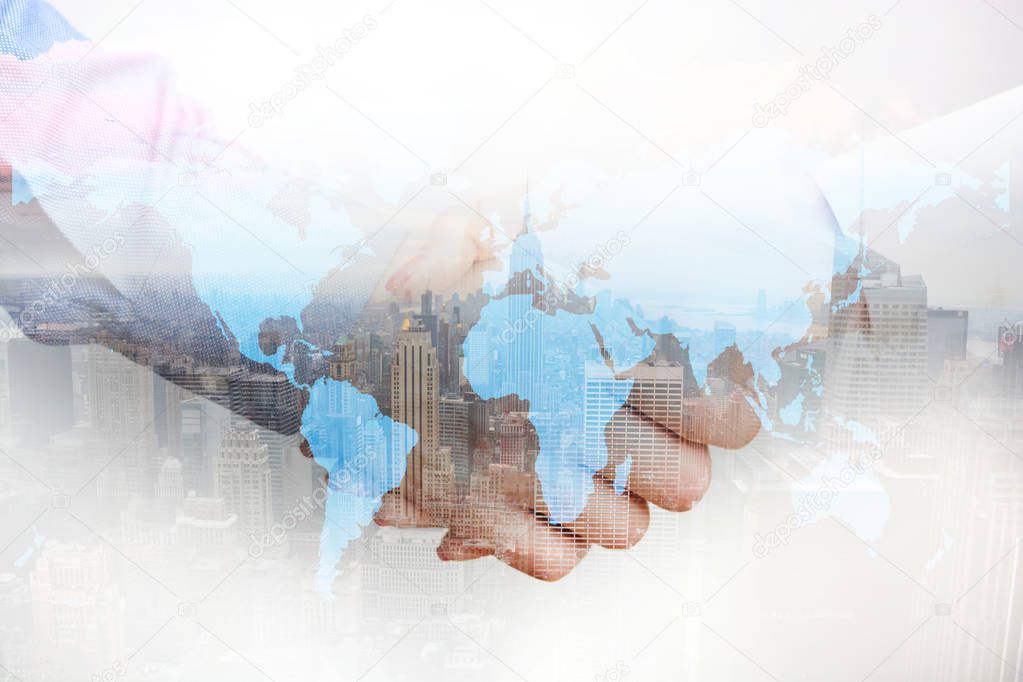 International affairs, composite image business people shaking hands and city skyscrapers