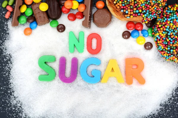 No sugar text written into a pile of white granulated sugar — Stock Photo, Image