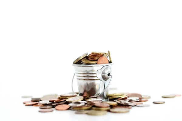 Metallic bucket full of money suggesting wealth — Stock Photo, Image