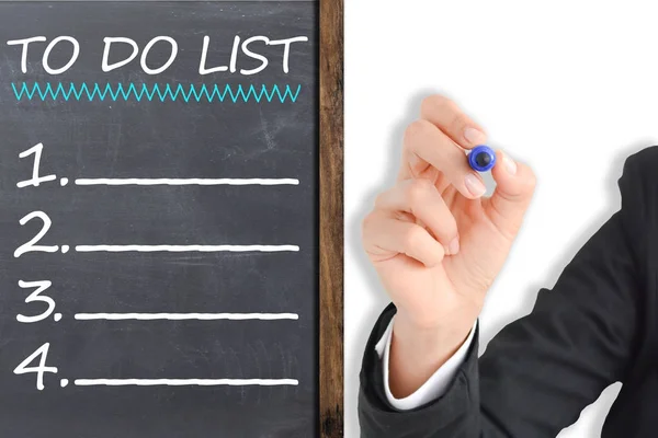 To do list made by businesswoman on chalkboard, business plan and targets of the company for the new year — Stock Photo, Image