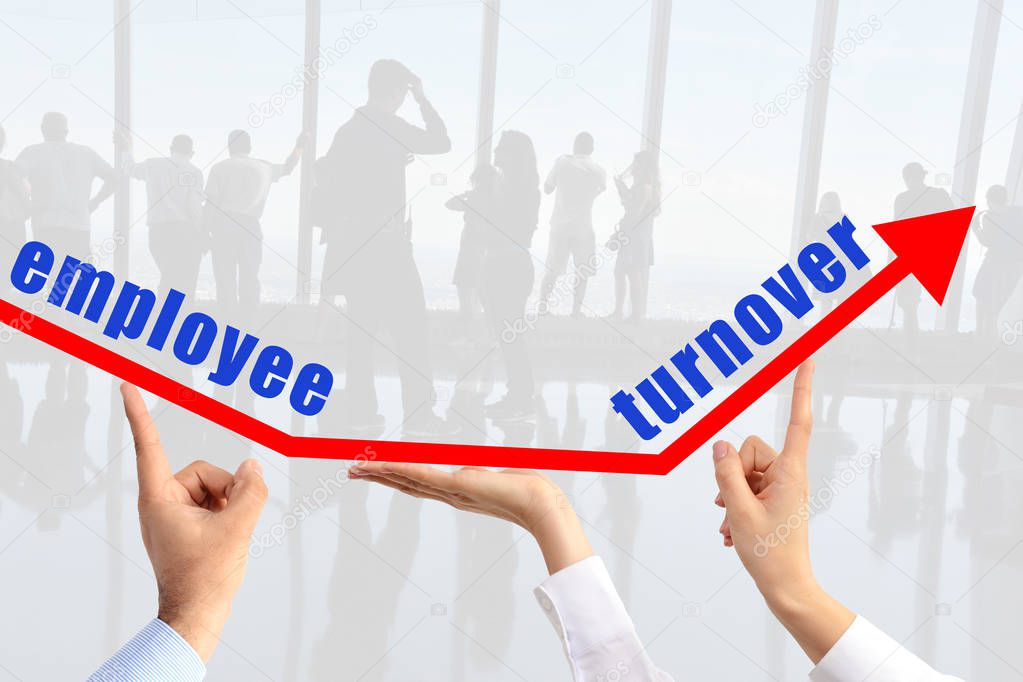 Employee turnover concept, with human hands sustaining an arrow