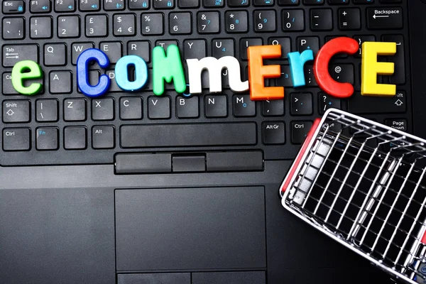 Commerce Concept Colorful Letter Blocks Shopping Trolley Notebook Keyboard — Stock Photo, Image