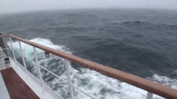 Deck yacht on background of waves of Arctic Ocean. — Stock Video